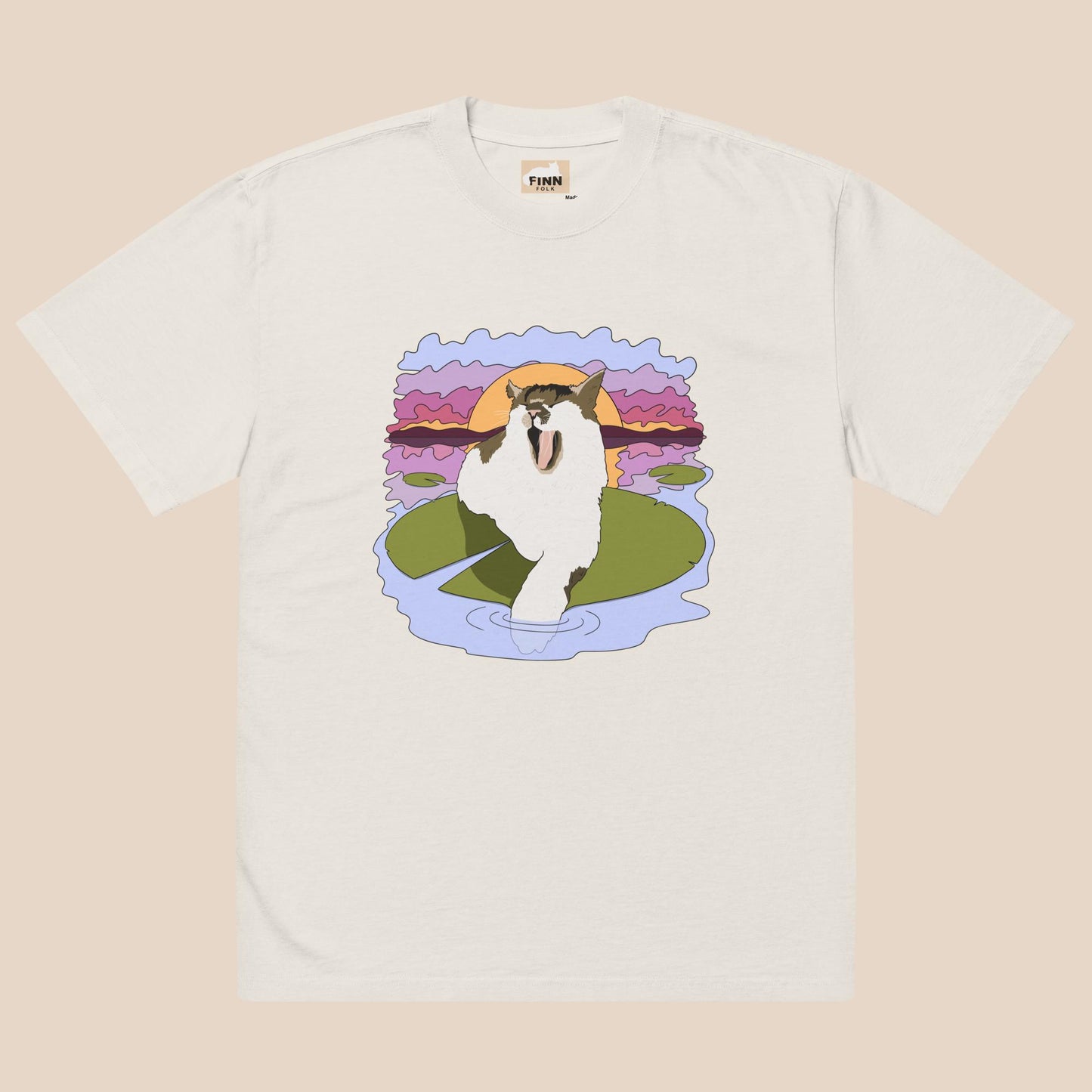 White t-shirt with a graphic of a cat on a lily pad and sunset design.